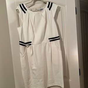 Cream ponte dress with back zip with leather look straps on shoulder and waist